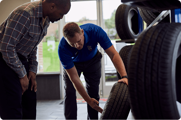 Belle Tire Employee Helping Customer